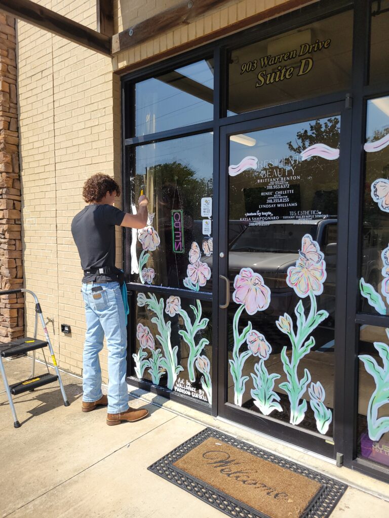 Me professionally cleaning a window